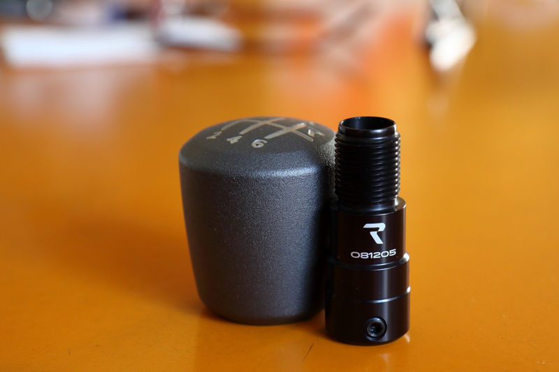 With the 6061 Billet Aluminum shift knob adapter (with integrated shift boot retainer)